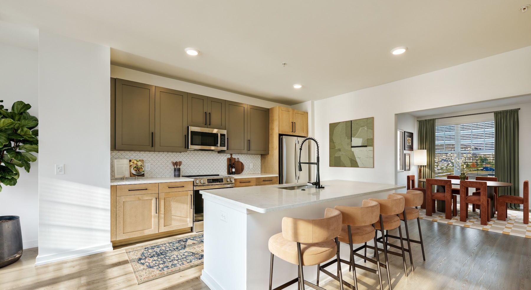 living room with wooden features throughout kitchen and easy access to stairs