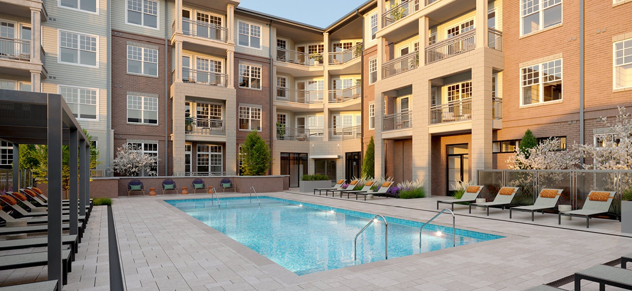 Tailored Amenities Resort-style swimming pool with lounge seating